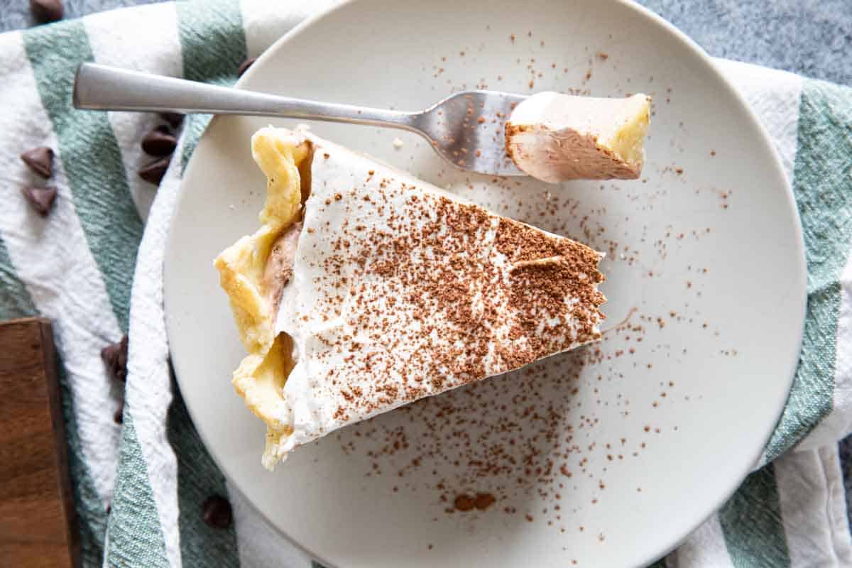 overhead view of slice of chocolate cream pie