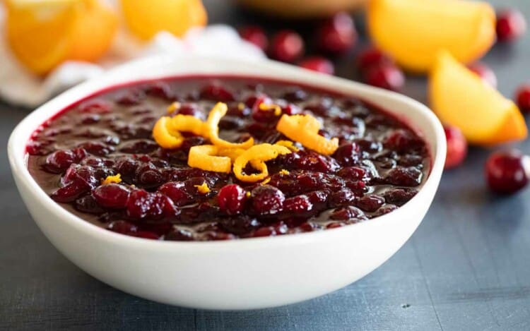bowl of cranberry sauce topped with orange zest