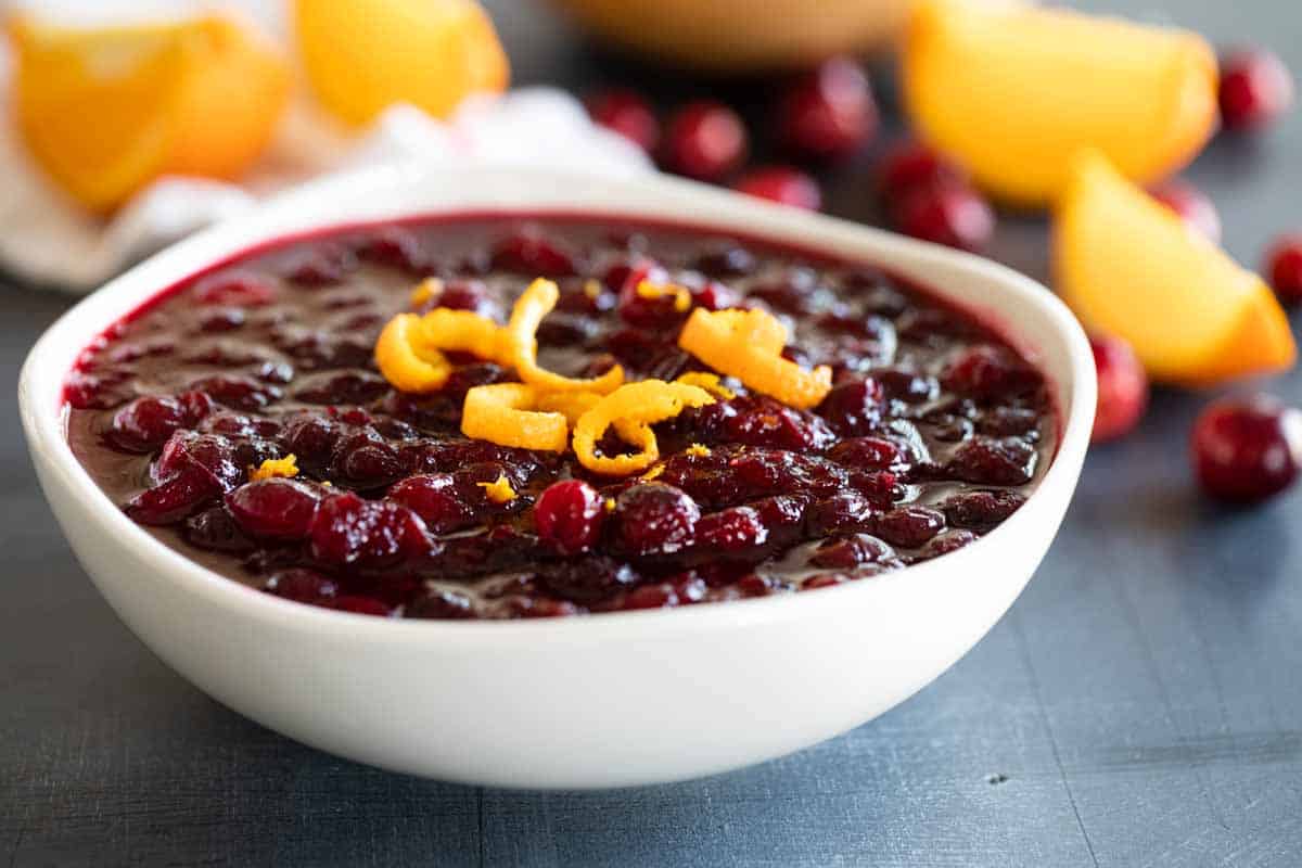bowl of cranberry sauce topped with orange zest