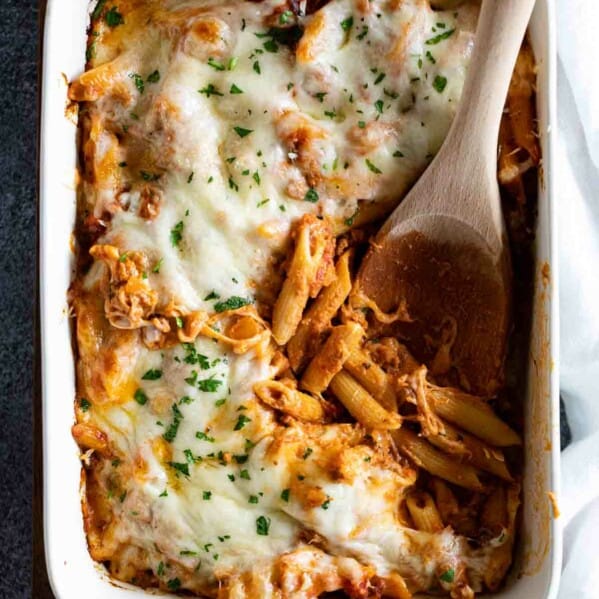 overhead view of Penne Pasta Bake recipe with wooden serving spoon