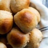 overhead view of basket of whole wheat rolls