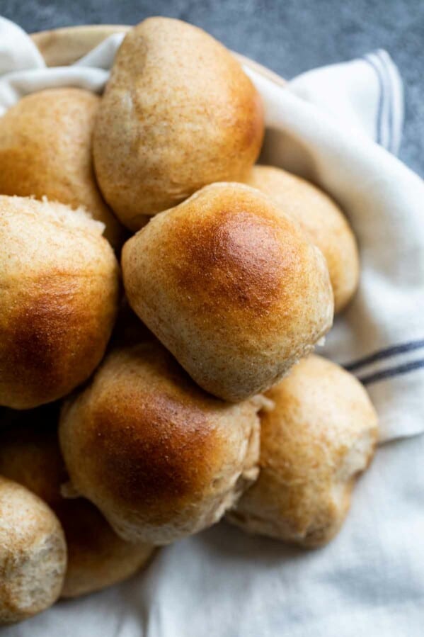 overhead view of basket of whole wheat rolls