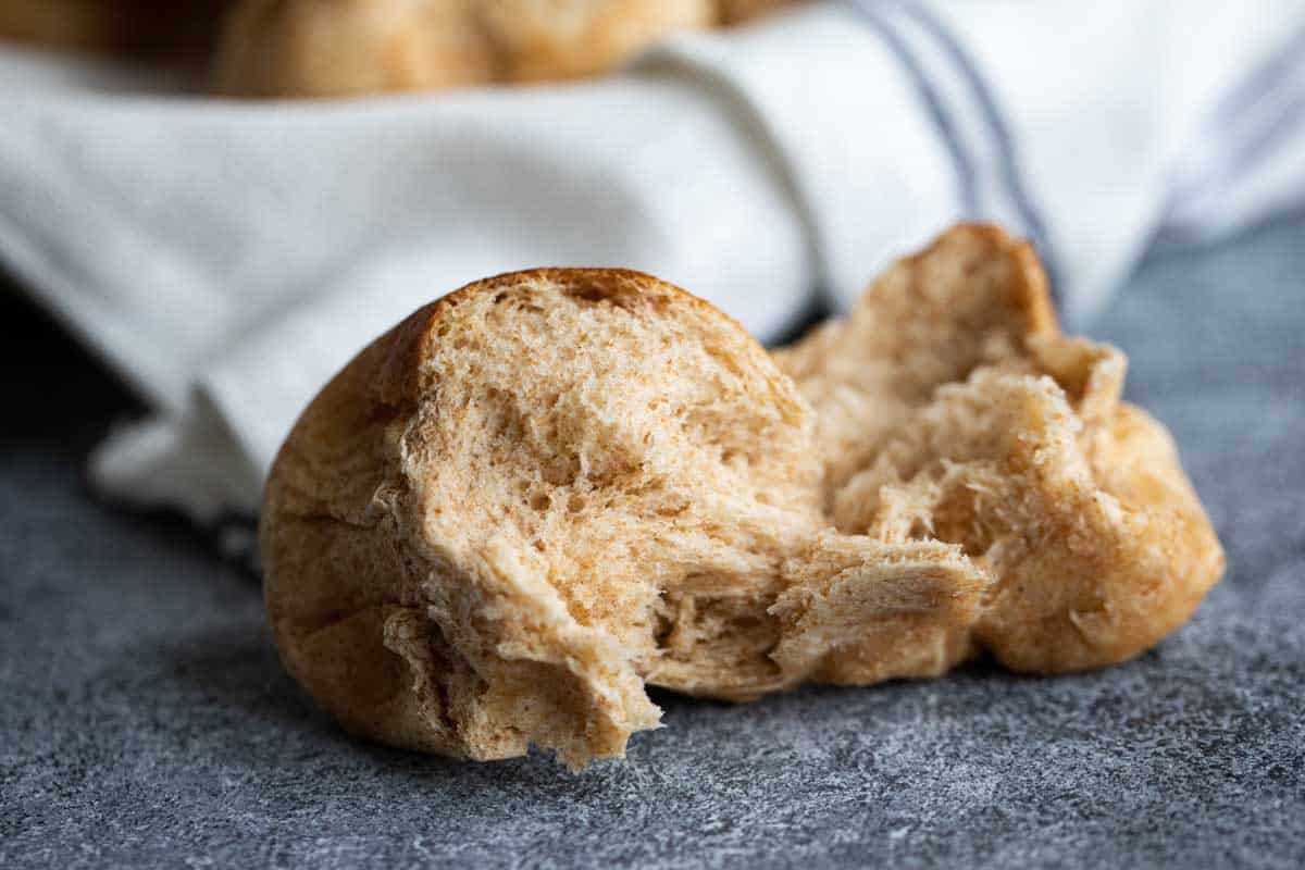 whole wheat roll torn in half to show texture