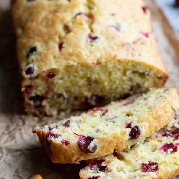 slices of cranberry orange bread with fresh cranberries