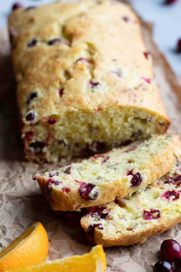 slices of cranberry orange bread with fresh cranberries