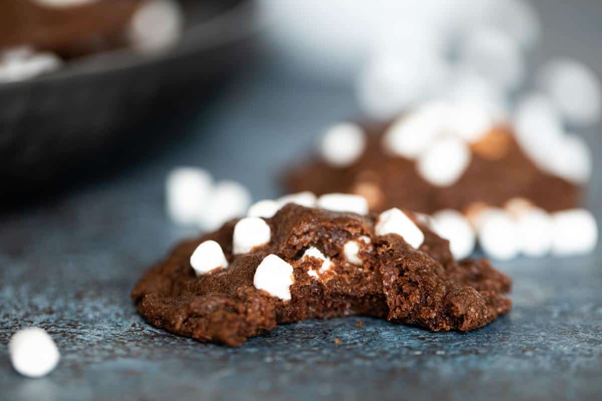 hot cocoa cookie with bite taken from it