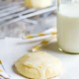 Lemon Ricotta Cookie on a napkin with milk and straws