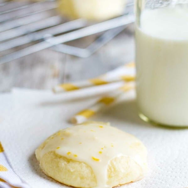 Lemon Ricotta Cookie on a napkin with milk and straws