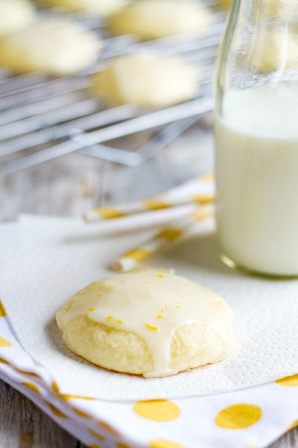 Lemon Ricotta Cookie on a napkin with milk and straws