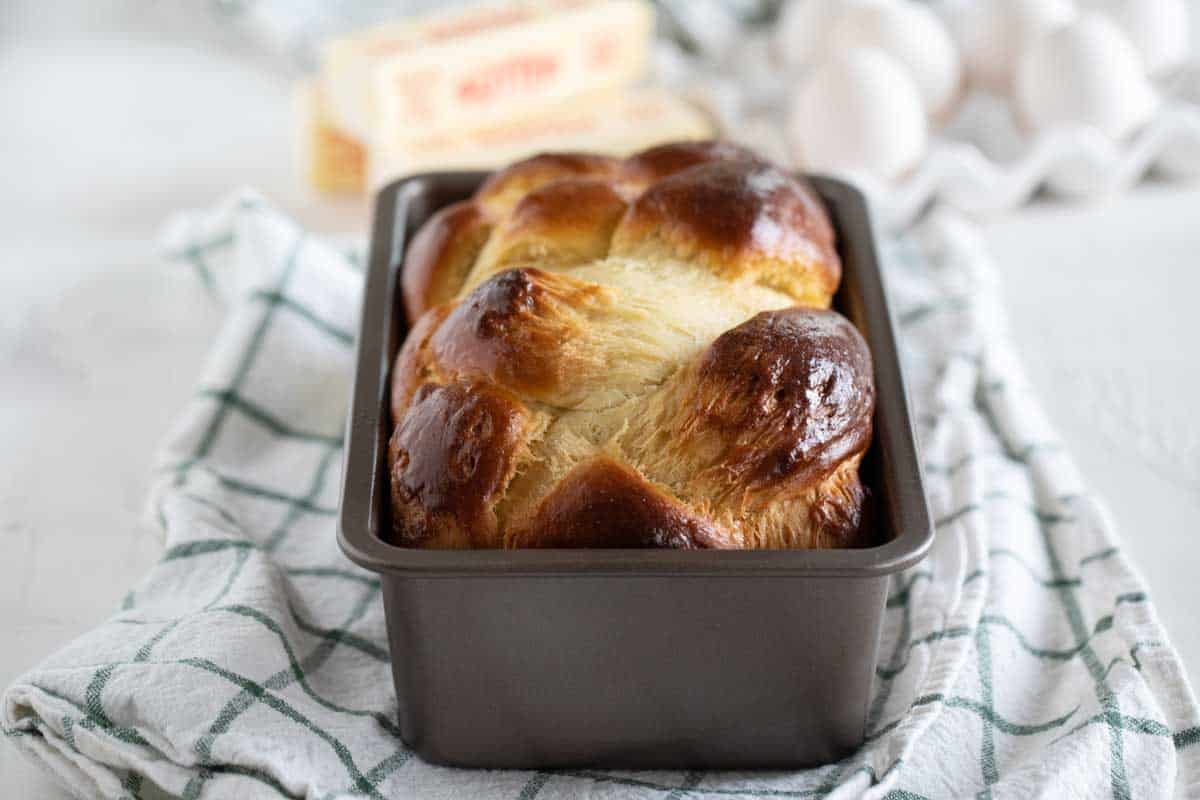 baked loaf of brioche in a loaf pan