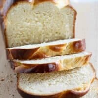 sliced loaf of brioche on a cutting board