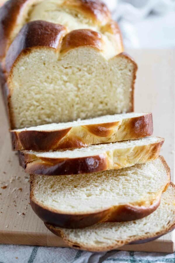 sliced loaf of brioche on a cutting board