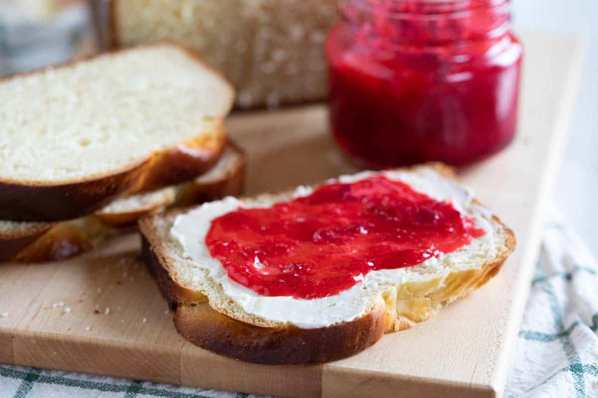 sliced brioche topped with butter and jam