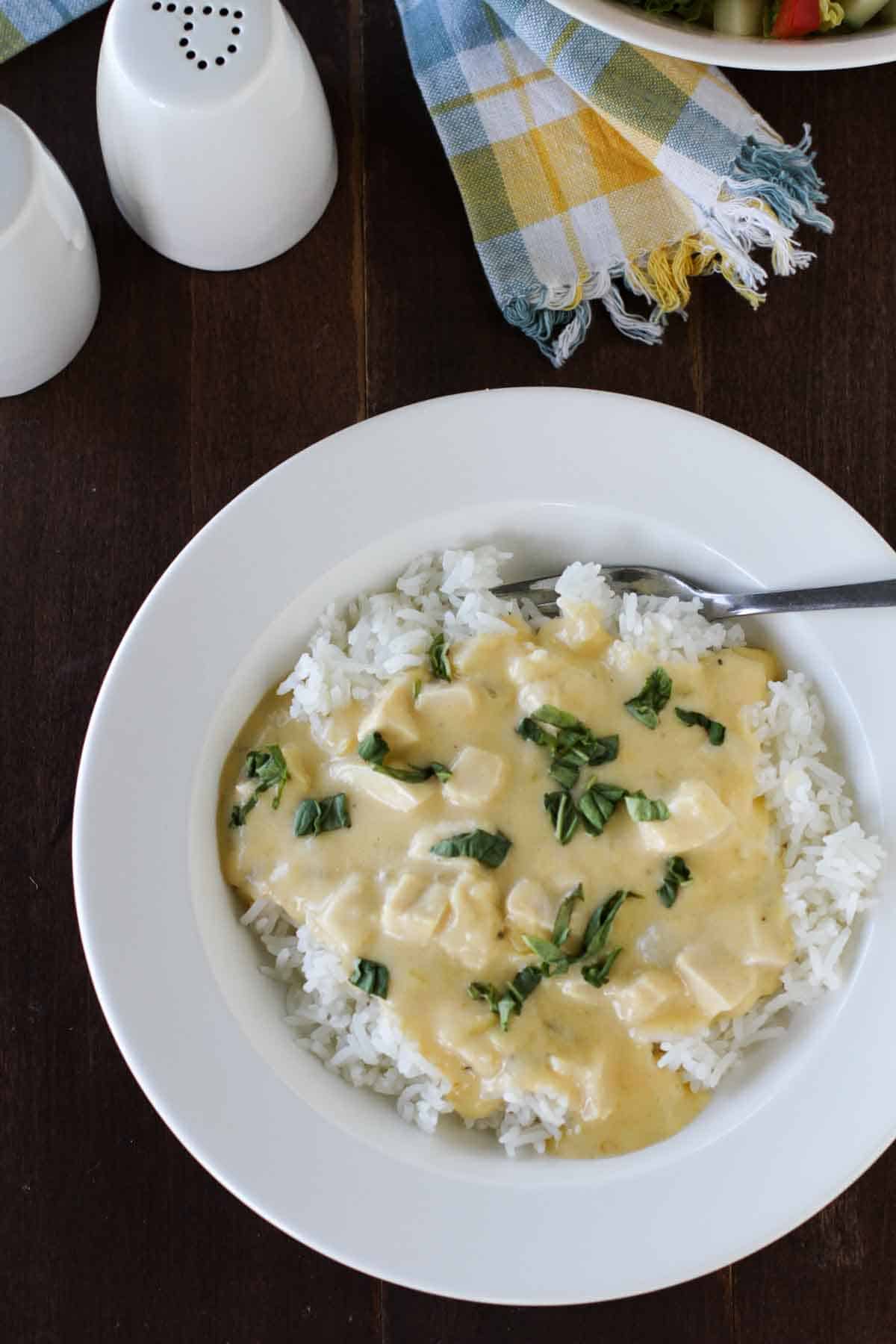 overhead view of a deep plate full of Cheesy Sour Cream Chicken.