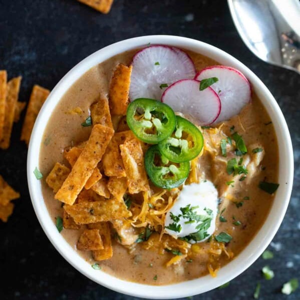 overhead view of a bowl filled with chicken enchilada soup