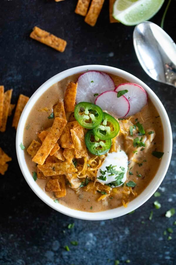 overhead view of a bowl filled with chicken enchilada soup