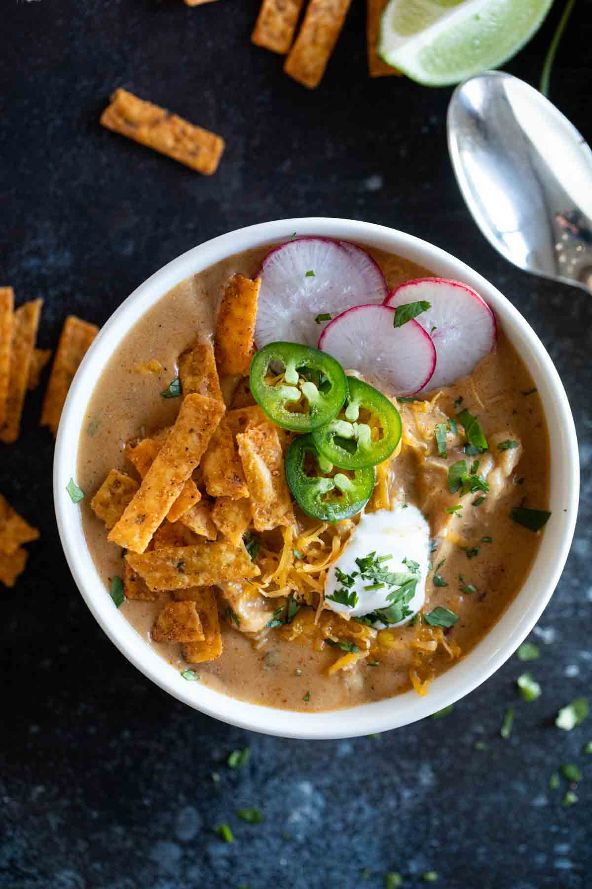 overhead view of a bowl filled with chicken enchilada soup