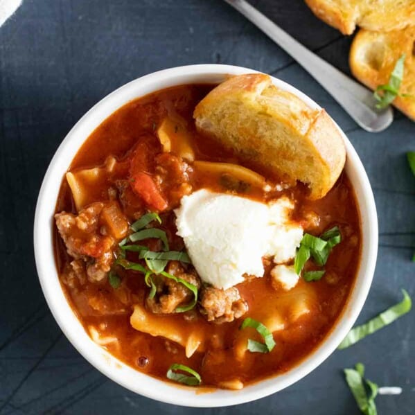 overhead view of a bowl of Lasagna Soup topped with ricotta cheese