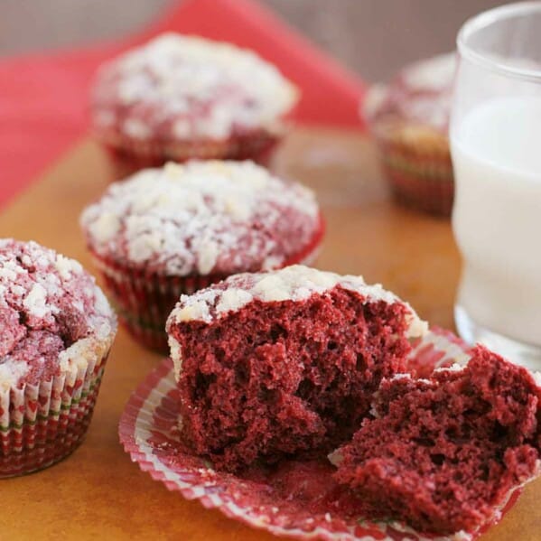 red velvet muffin broken in half to show the interior texture.