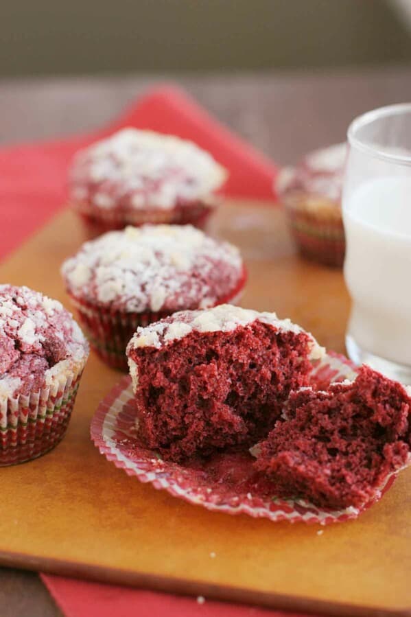 red velvet muffin broken in half to show the interior texture.