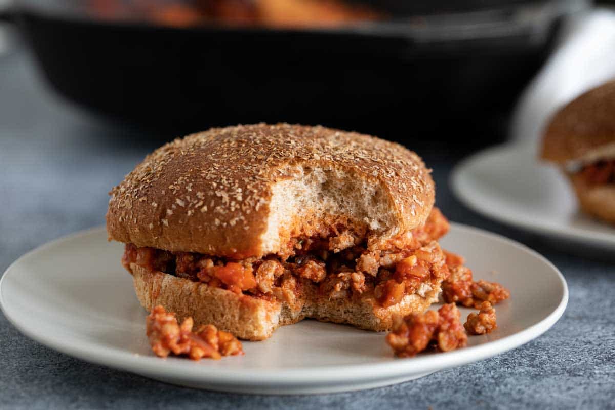 Turkey Sloppy Joe on a plate with bite taken from it