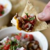 tortilla chip with 7 layer chili dog dip