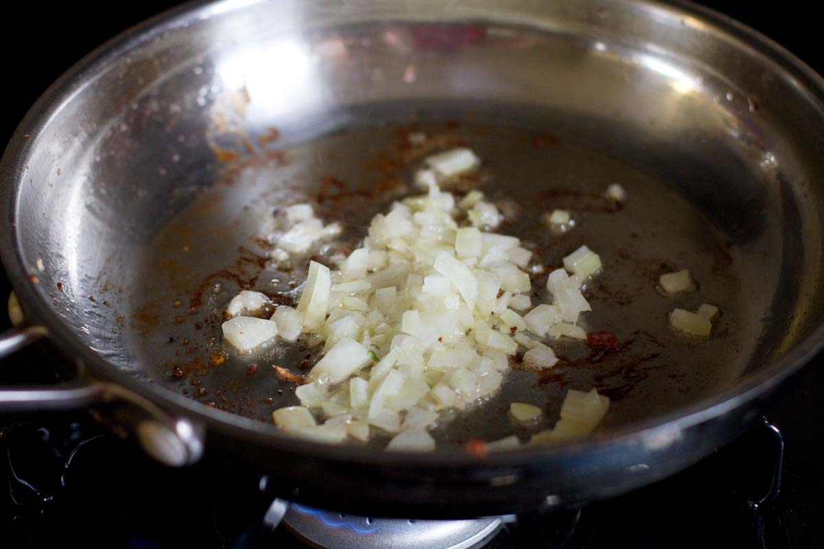 diced onion cooking in a skillet