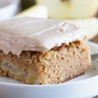 close up shot of slice of apple cinnamon sheet cake