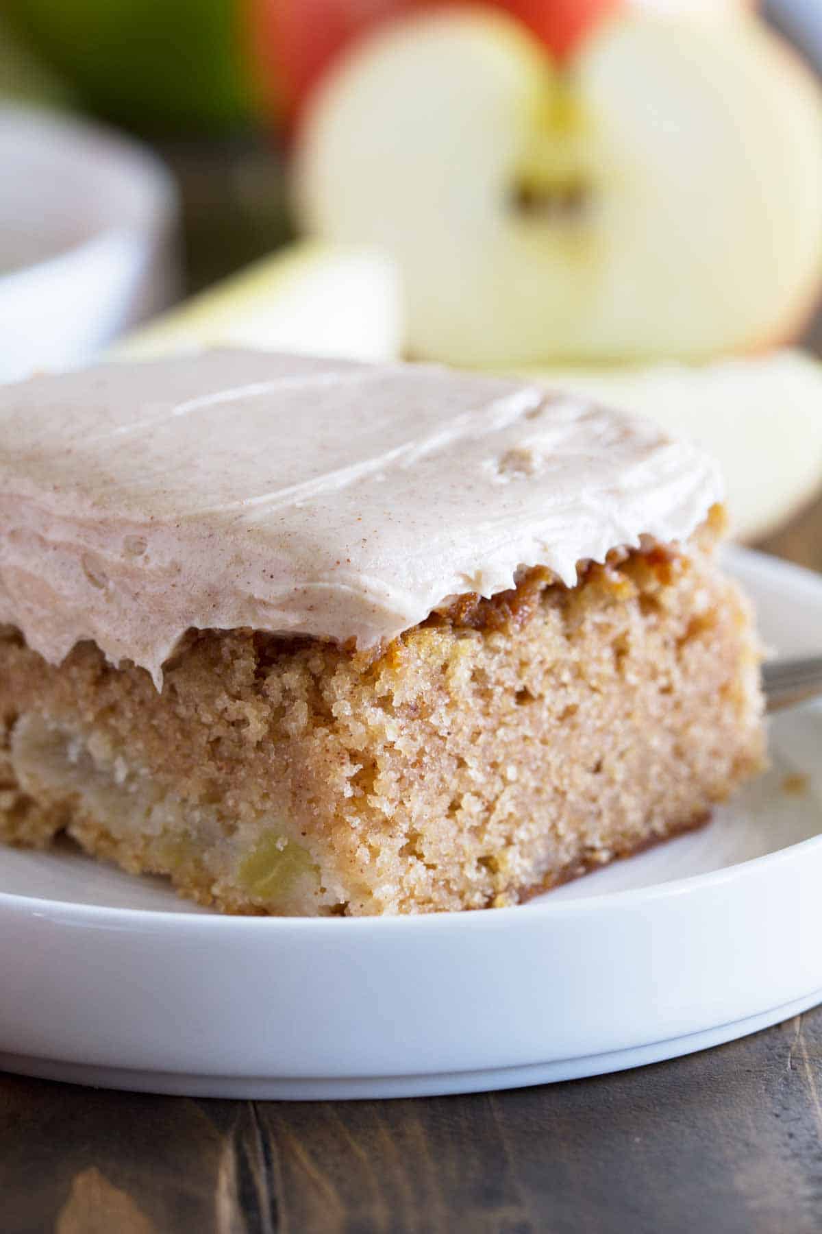 close up shot of slice of apple cinnamon sheet cake