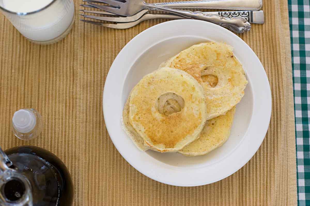 Apple Pancake Rings - Fresh apples sliced and dipped in pancake batter, then cooked until golden. Great for breakfast or for an after school snack! overhead view of Apple Pancake Rings
