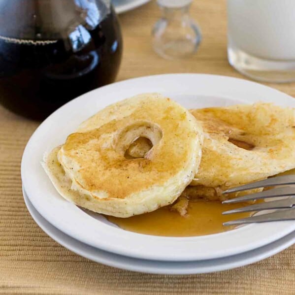Apple Pancake Rings on a plate served with syrup