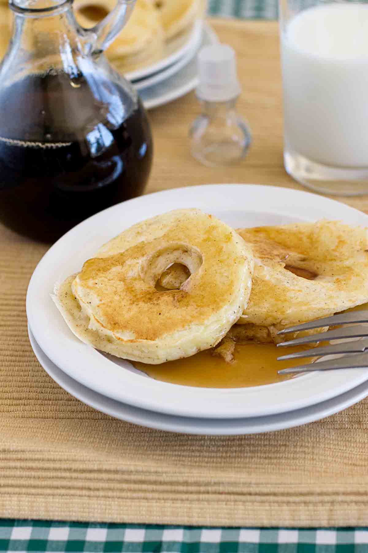 Apple Pancake Rings on a plate served with syrup