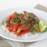 Asian Pepper Steak on a plate with a lime wedge