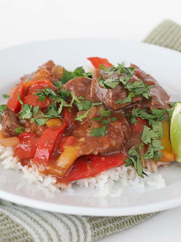 Asian Pepper Steak on a plate with a lime wedge