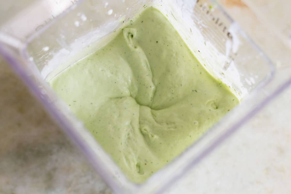 Avocado Ranch Salad Dressing in a blender being blended