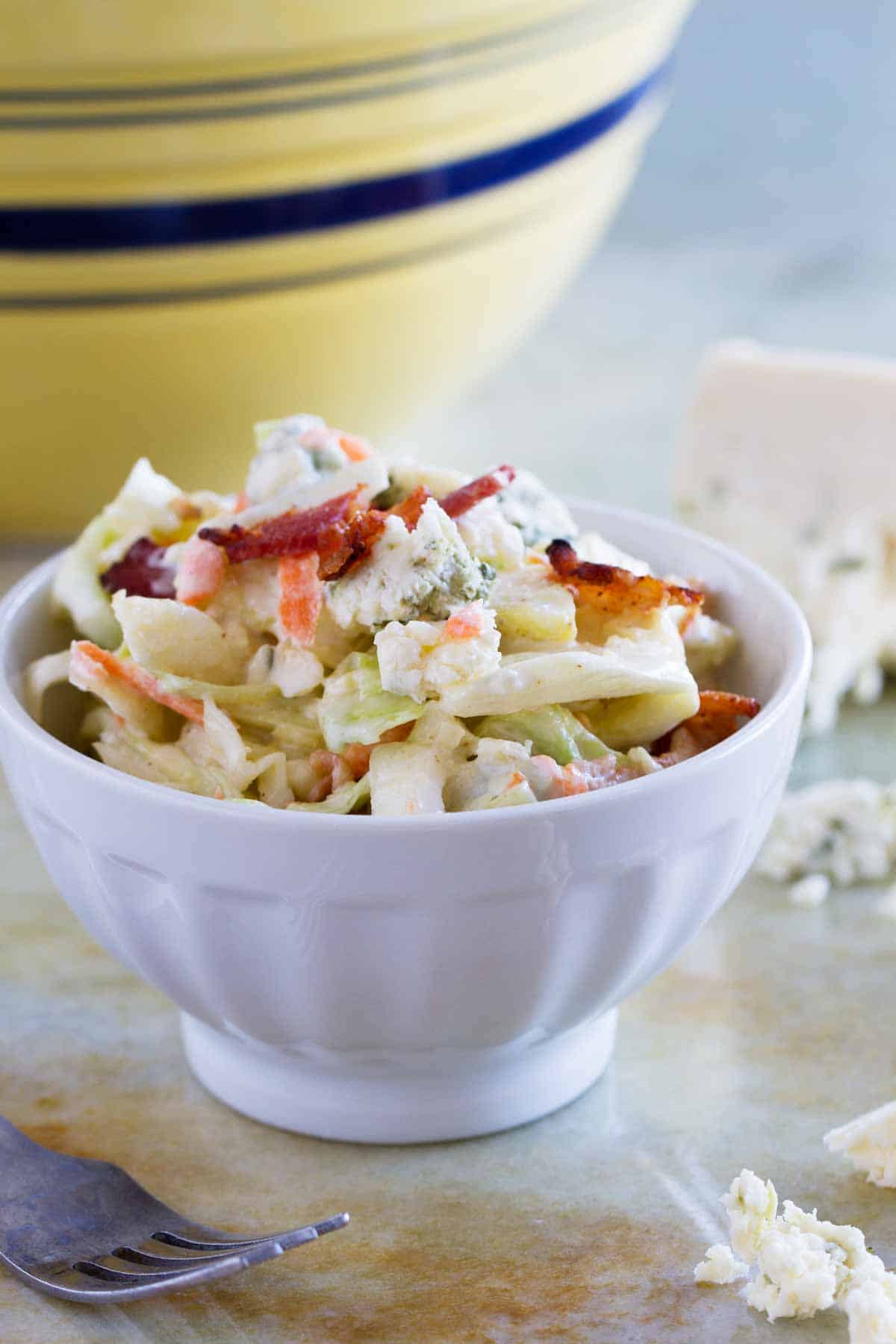 small bowl with a portion of Bacon Blue Cheese Coleslaw