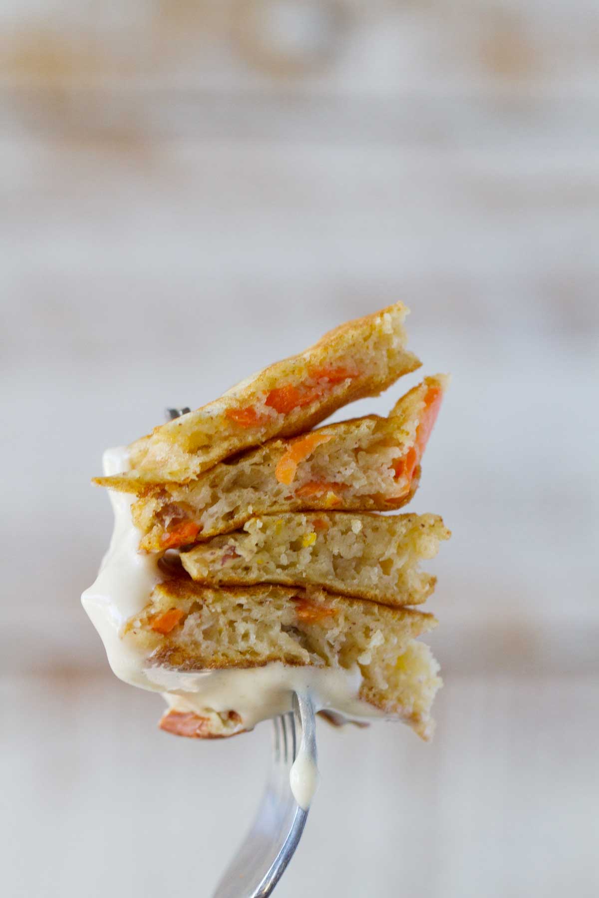 bite of carrot cake pancakes on a fork