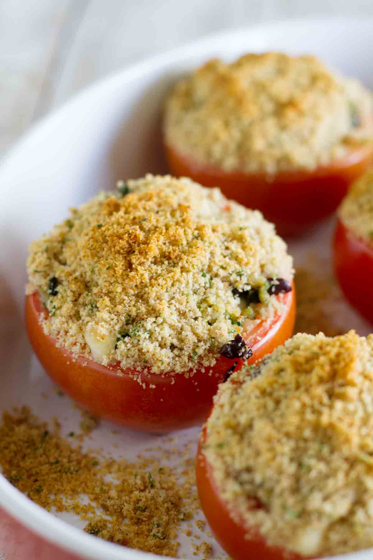 Cheesy Italian Stuffed Tomatoes in a baking dish.