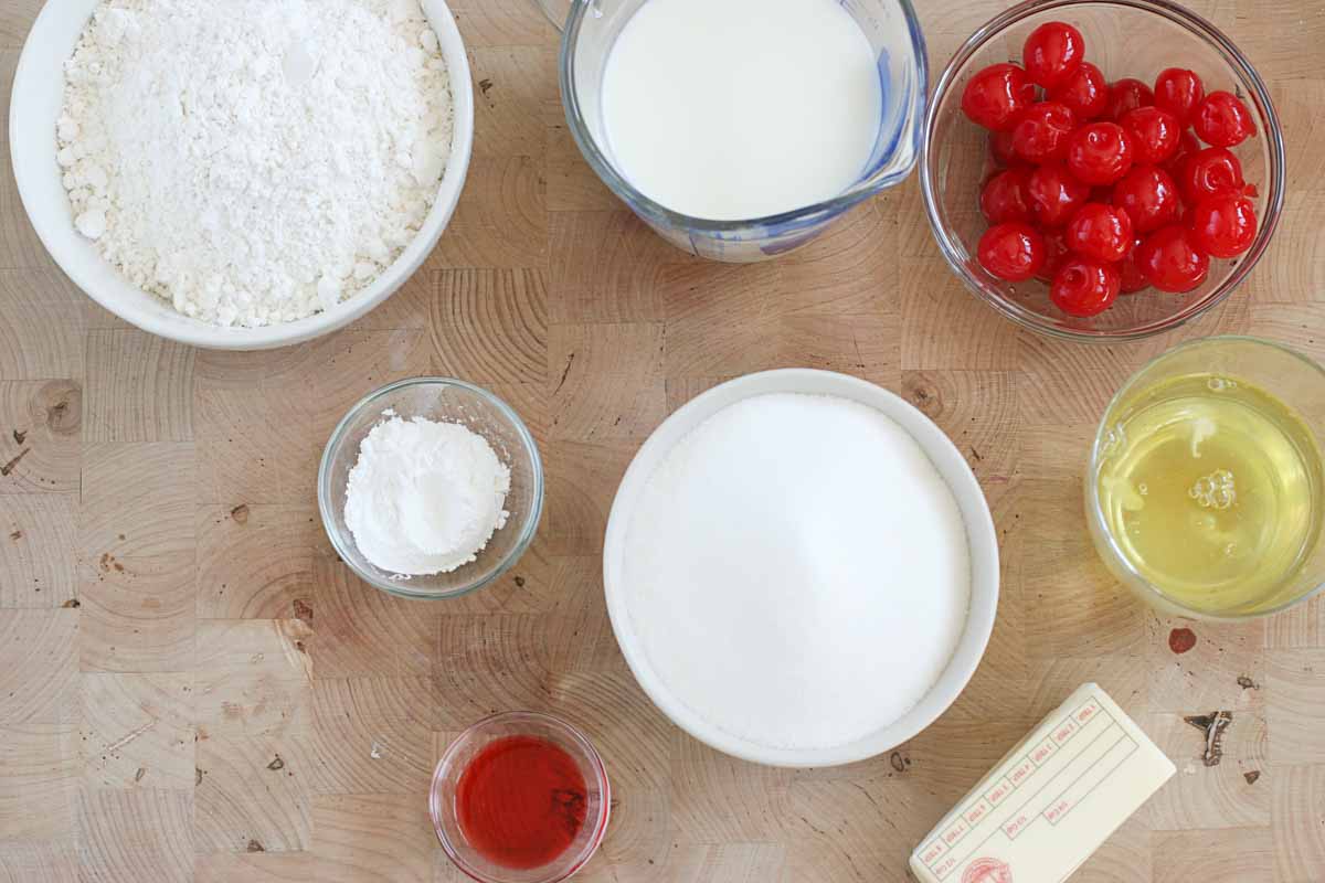 Ingredients needed to make a cherry chip cake from scratch.