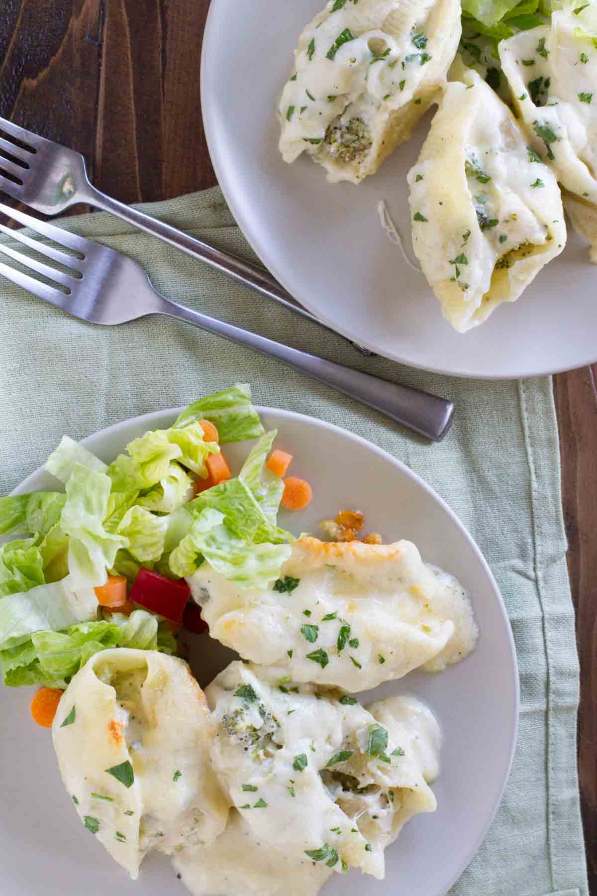 overhead view of plates with chicken alfredo stuffed shells