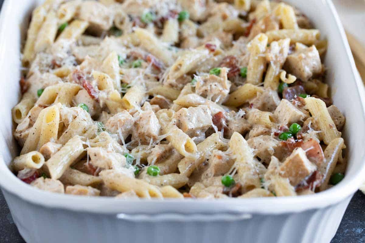 Full casserole dish with chicken bacon pasta.