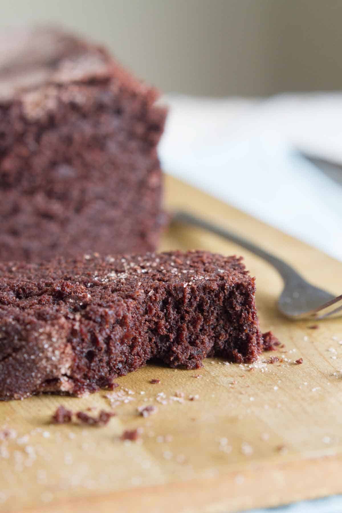 single slice of chocolate cinnamon bread with a bite taken from it