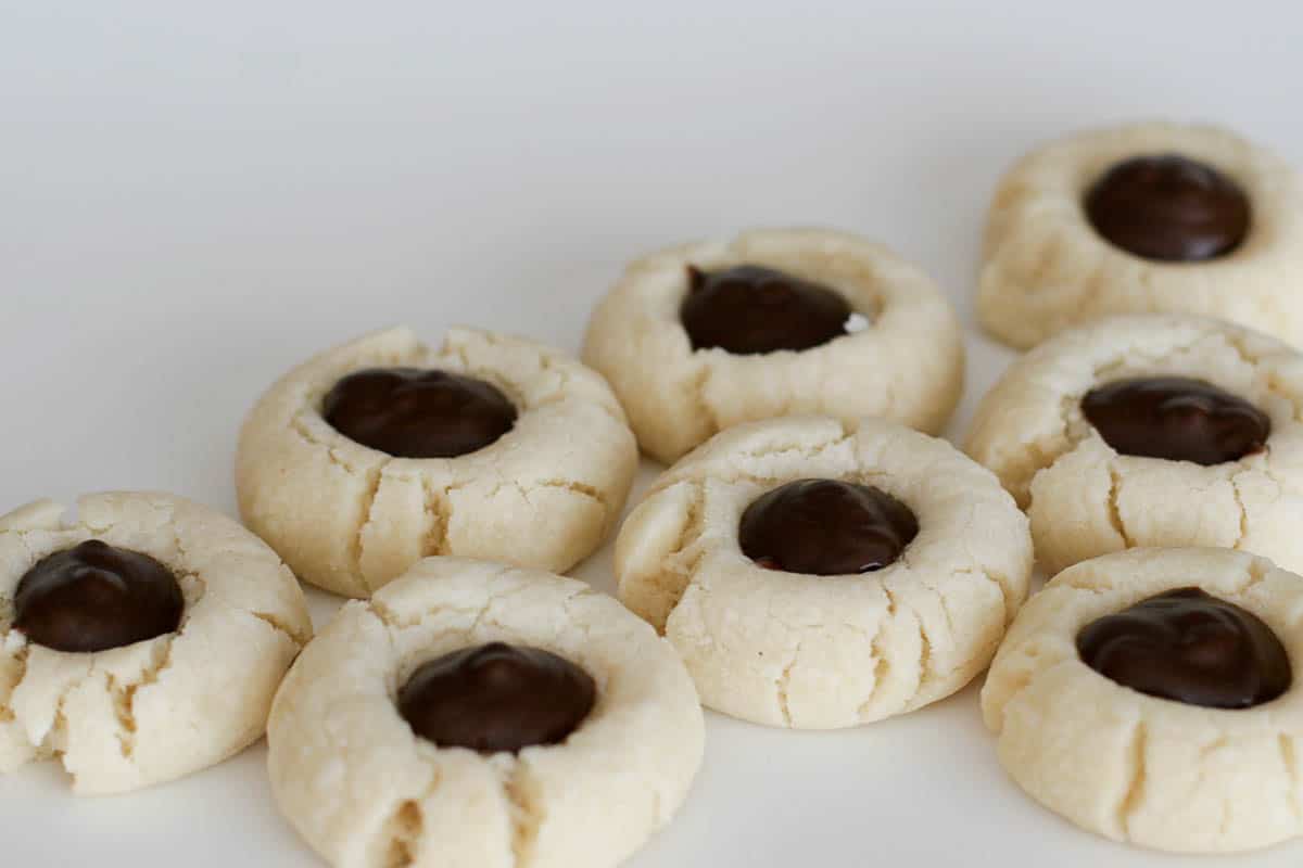 Chocolate Thumbprints - cookies with chocolate filling on a white background