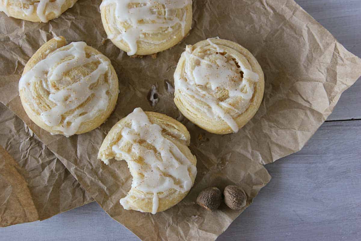 overhead view of Easy Eggnog Pinwheels with a bite taken from one