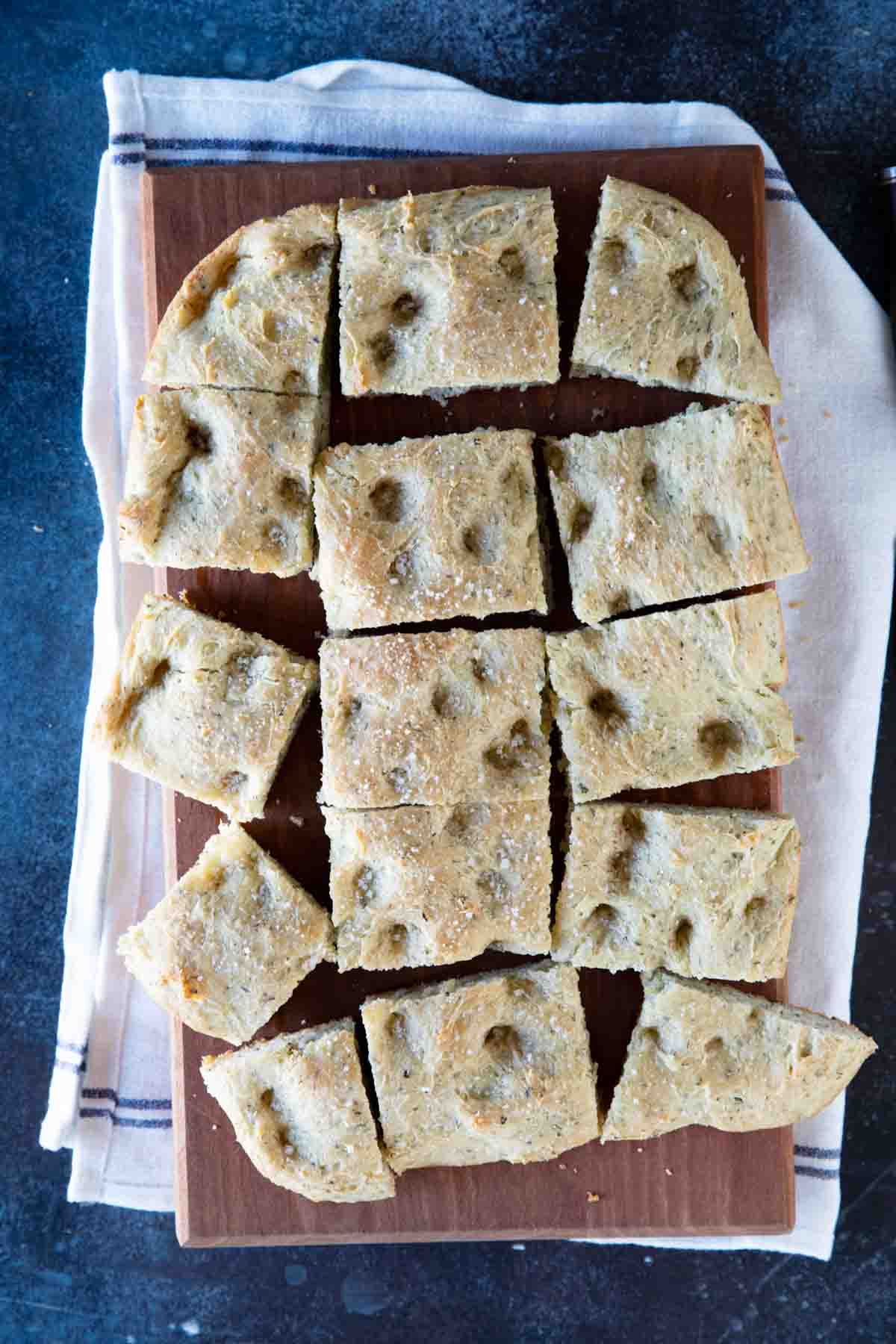 overhead view of focaccia bread sliced into pieces