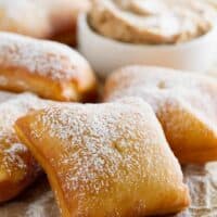 fried German scones sprinkled with powdered sugar