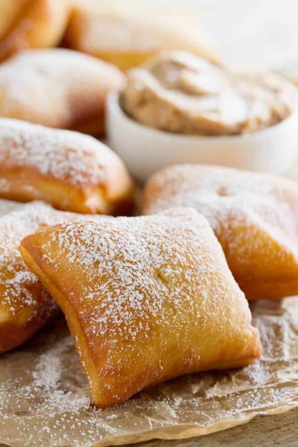 fried German scones sprinkled with powdered sugar