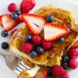 overhead view of stack of Ice Cream Soaked French Toast topped with berries