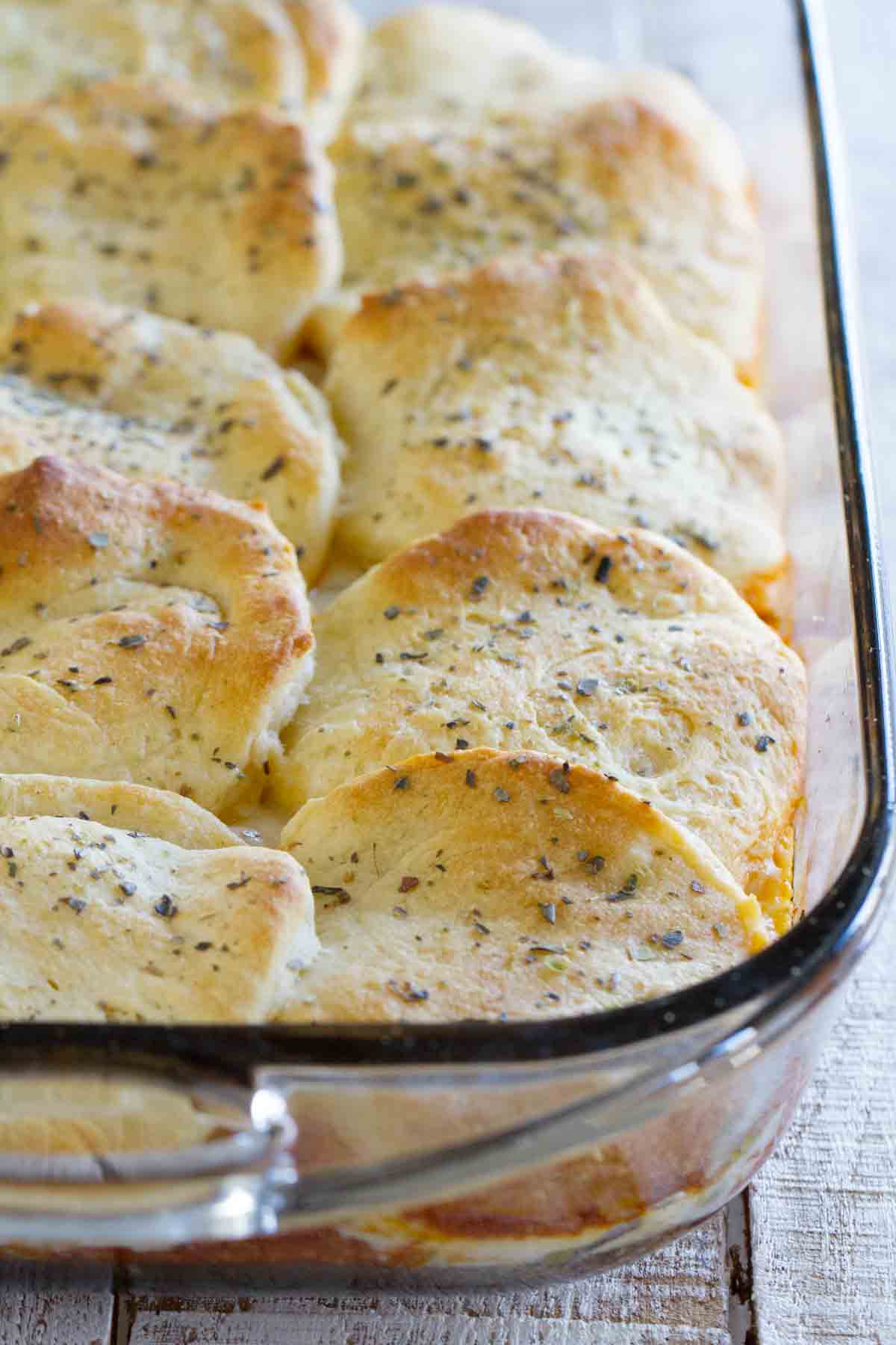 Italian Ground Beef Casserole with Biscuit Topping in a baking dish
