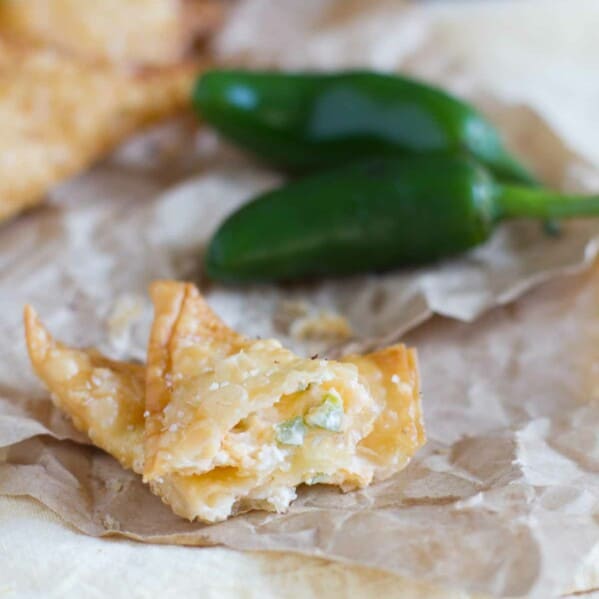 Jalapeno Popper Wonton on paper opened up to show filling.